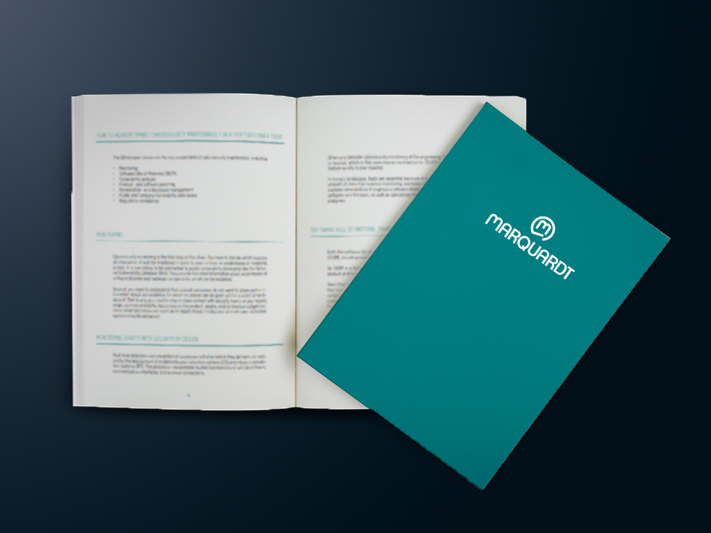 Open Brochure with text and turquoise Marquardt Brochure